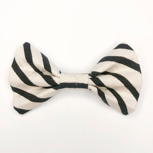 Quality bow tie made for large dogs, dogs with long fur, and little dogs looking to make a bold statement.  Each bow tie is made with quality quilting cotton and stiff interfacing with two loops of elastic. The two elastic loops to prevent bow tie drooping and fits tightly over a standard 1” wide dog collar.  Bow tie Length 5“". Height 3.5".  Elastic fits 1” collar. 