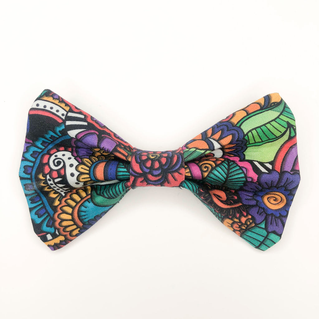 Quality bow tie made for large dogs, dogs with long fur, and little dogs looking to make a bold statement.  Each bow tie is made with quality quilting cotton and stiff interfacing with two loops of elastic. The two elastic loops to prevent bow tie drooping and fits tightly over a standard 1” wide dog collar.  Bow tie Length 5“". Height 3.5".  Elastic fits 1” collar. 