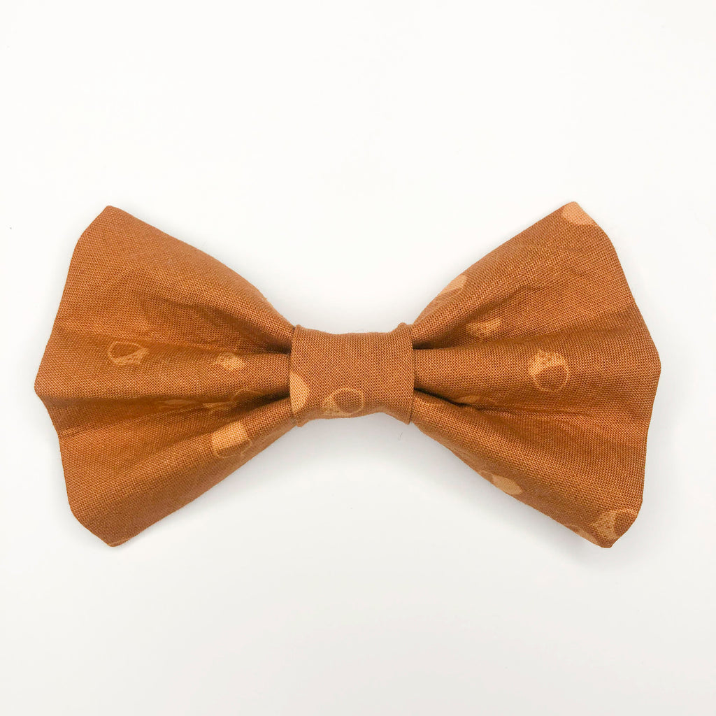 Quality bow tie made for large dogs, dogs with long fur, and little dogs looking to make a bold statement.  Each bow tie is made with quality quilting cotton and stiff interfacing with two loops of elastic. The two elastic loops to prevent bow tie drooping and fits tightly over a standard 1” wide dog collar.  Bow tie Length 5“". Height 3.5".  Elastic fits 1” collar. 