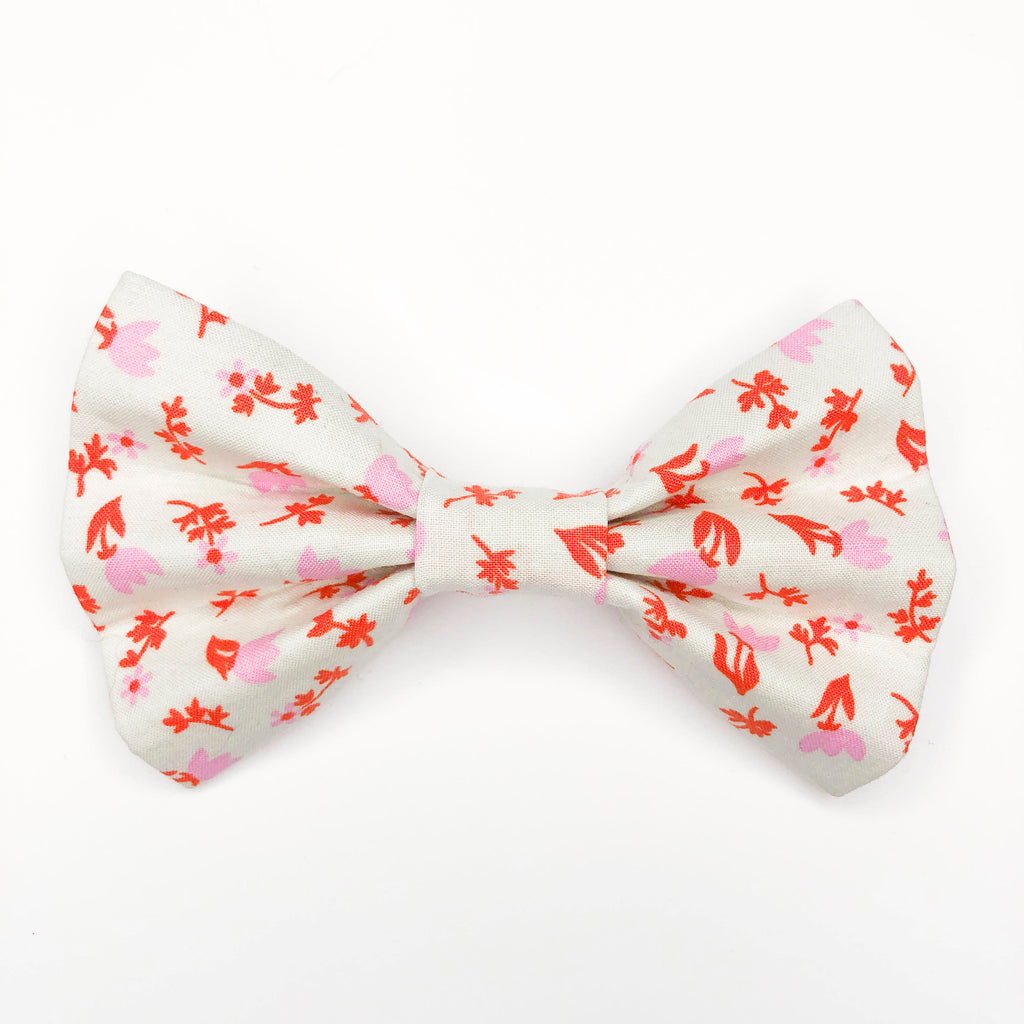 Quality bow tie made for large dogs, dogs with long fur, and little dogs looking to make a bold statement.  Each bow tie is made with quality quilting cotton and stiff interfacing with two loops of elastic. The two elastic loops to prevent bow tie drooping and fits tightly over a standard 1” wide dog collar.  Bow tie Length 5“". Height 3.5".  Elastic fits 1” collar.  Lora Lynn Design