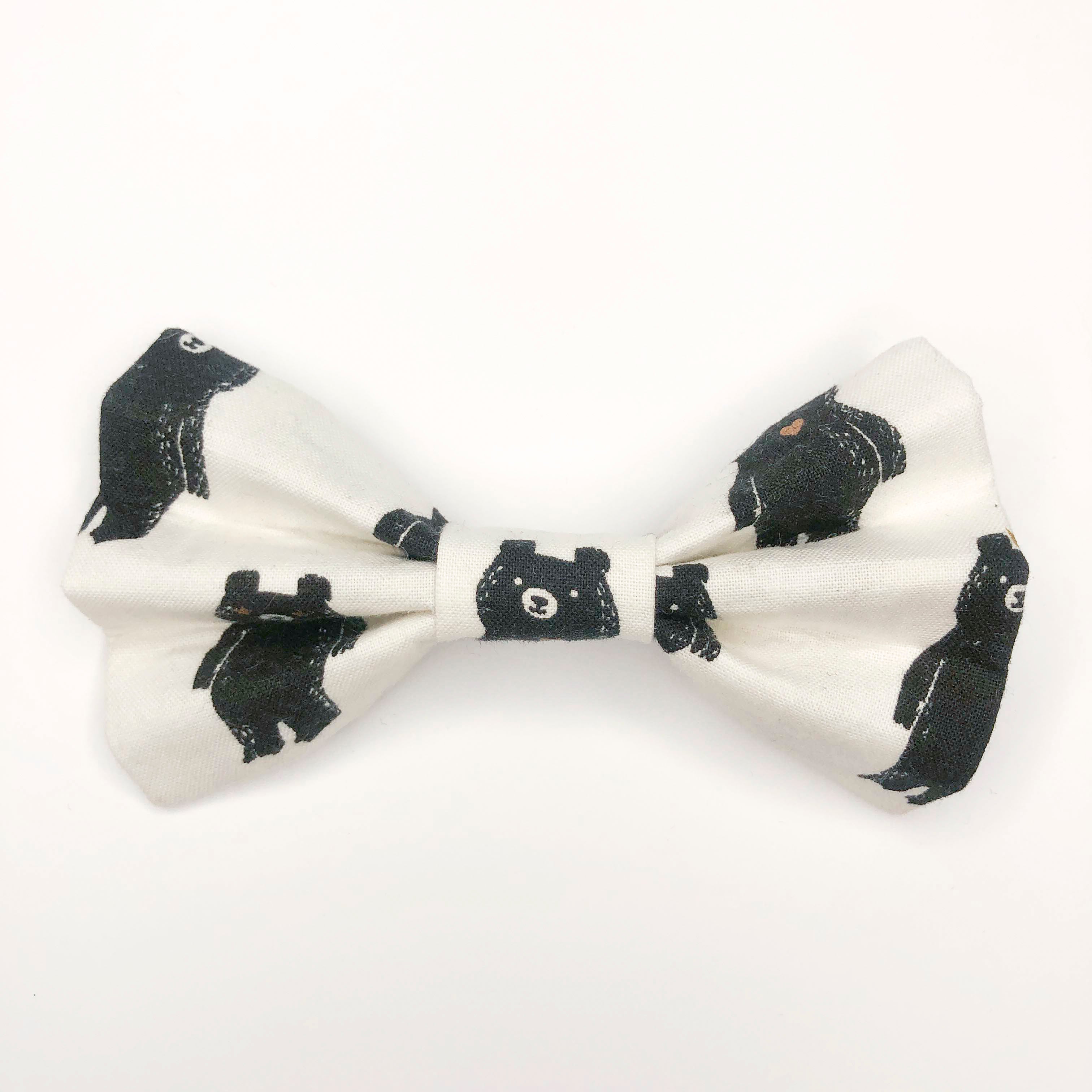 Quality bow tie made for large dogs, dogs with long fur, and little dogs looking to make a bold statement.  Each bow tie is made with quality quilting cotton and stiff interfacing with two loops of elastic. The two elastic loops to prevent bow tie drooping and fits tightly over a standard 1” wide dog collar.  Bow tie Length 5“". Height 3.5".  Elastic fits 1” collar.  Lora Lynn Design