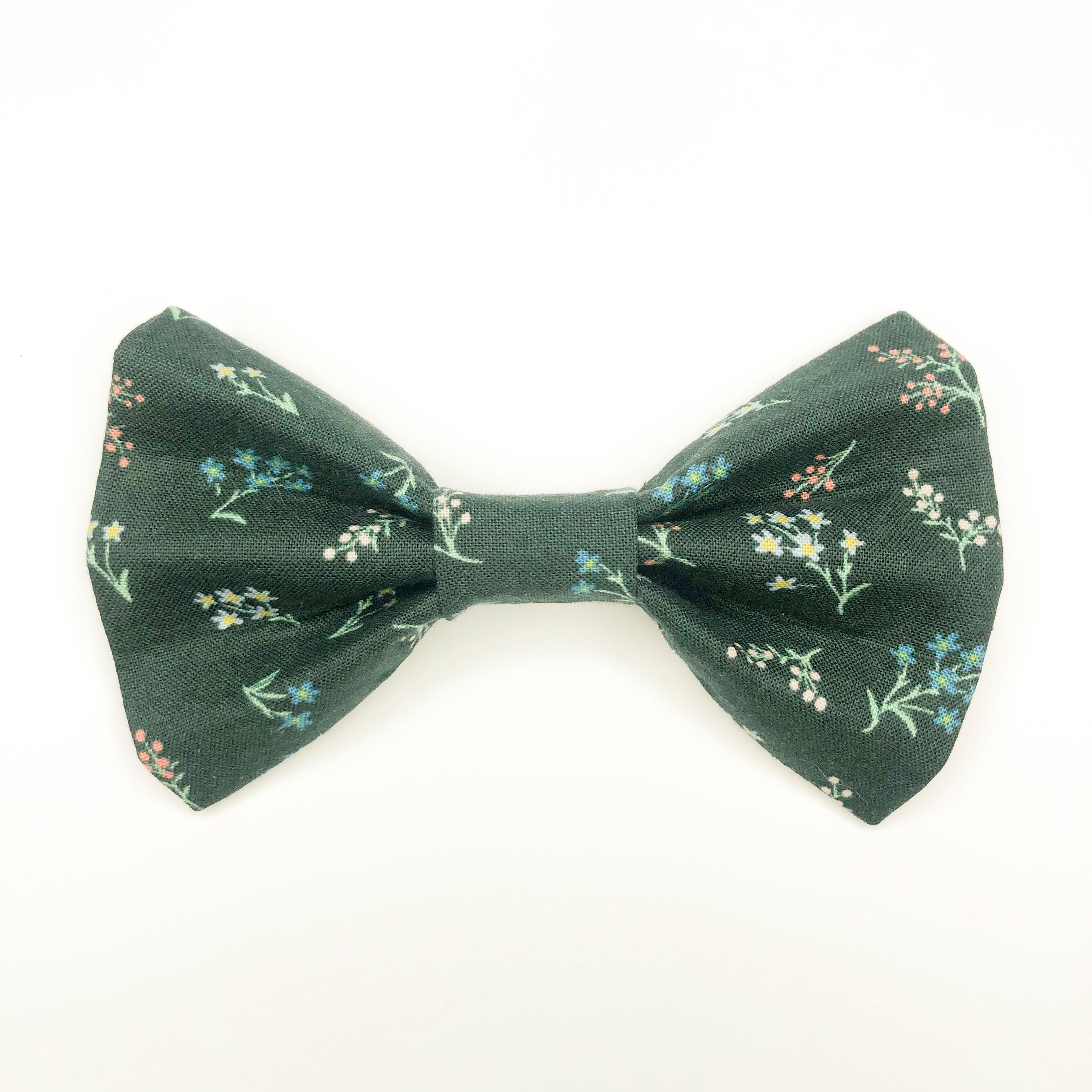 Quality bow tie made for large dogs, dogs with long fur, and little dogs looking to make a bold statement.  Each bow tie is made with quality quilting cotton and stiff interfacing with two loops of elastic. The two elastic loops to prevent bow tie drooping and fits tightly over a standard 1” wide dog collar.  Bow tie Length 5“". Height 3.5".  Elastic fits 1” collar.  Lora Lynn Design